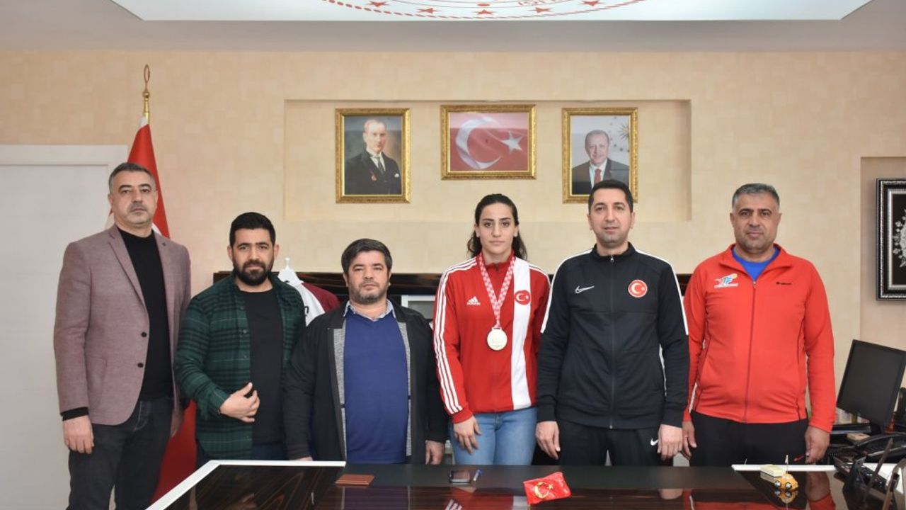 İl Müdürü Eren Şampiyon Özer ve Antrenörü Döndü'yü Ağırladı